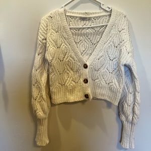 Cute knit sweater. Buttons up.